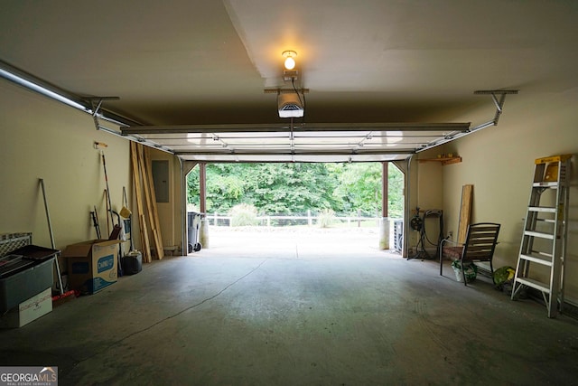 garage featuring a garage door opener and electric panel