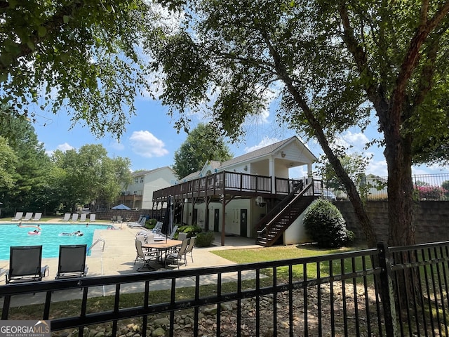 view of swimming pool with a deck and a patio area