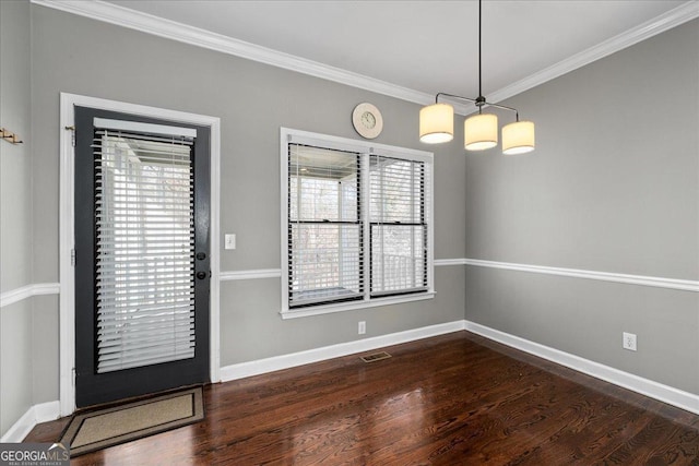 entrance foyer featuring crown molding, baseboards, and wood finished floors