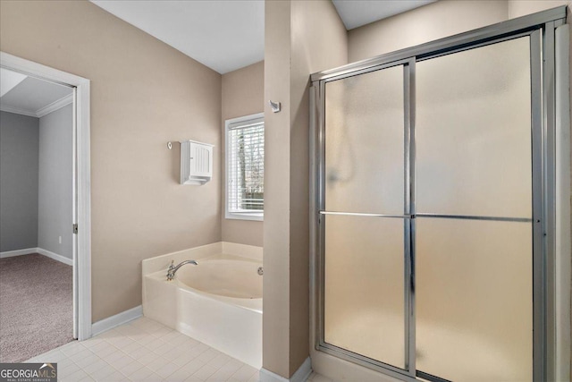 full bath featuring tile patterned floors, a shower stall, baseboards, and a bath