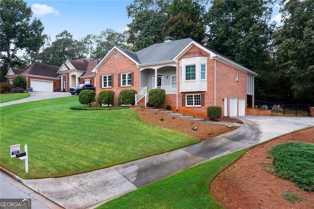 view of front of house with a garage, a porch, and a front lawn