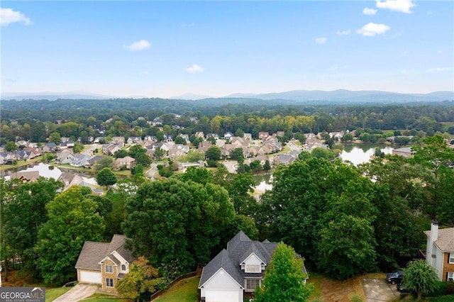 bird's eye view featuring a water view and a residential view