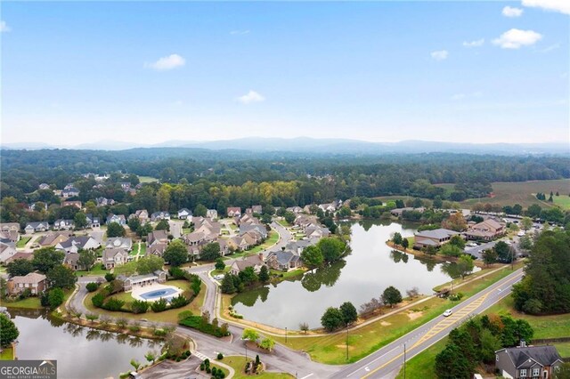 bird's eye view with a residential view and a water view