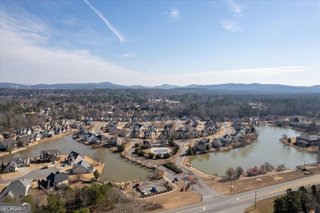 aerial view featuring a residential view and a water and mountain view