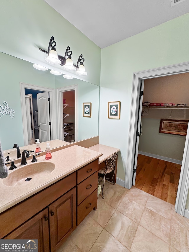 bathroom featuring vanity and hardwood / wood-style floors