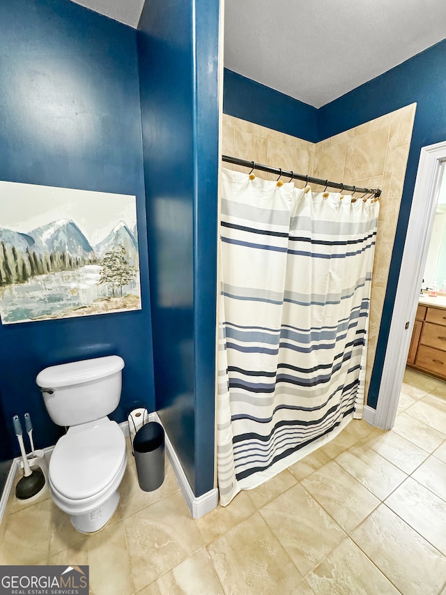 bathroom with toilet and a shower with shower curtain