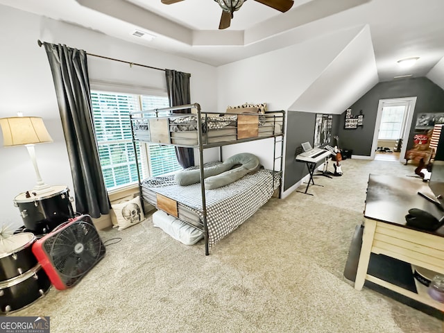 bedroom featuring carpet floors, lofted ceiling, and ceiling fan