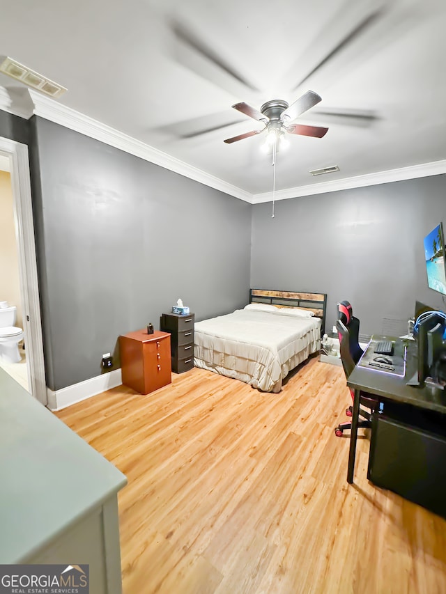 bedroom with ornamental molding, ceiling fan, and hardwood / wood-style flooring