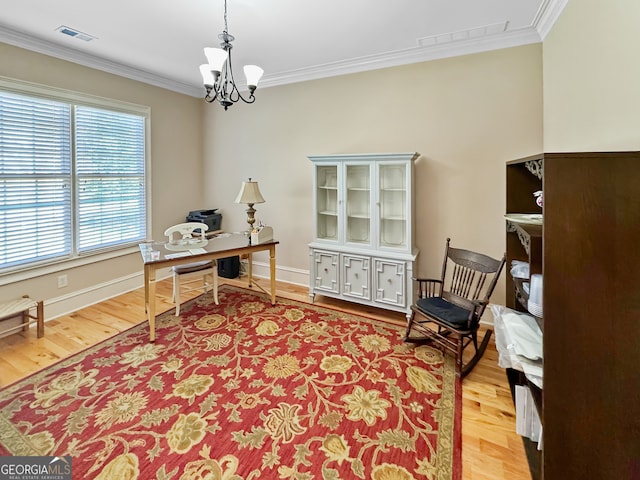 office area with an inviting chandelier, crown molding, and light hardwood / wood-style floors