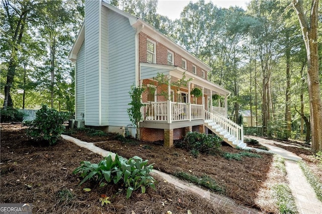 view of property exterior featuring covered porch