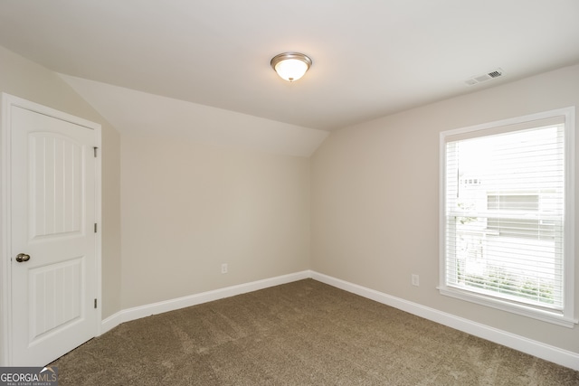 bonus room featuring carpet, lofted ceiling, and plenty of natural light