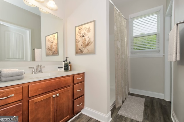 bathroom with vanity, lofted ceiling, hardwood / wood-style floors, and a shower with shower curtain