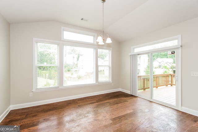 unfurnished dining area with a wealth of natural light and dark hardwood / wood-style flooring