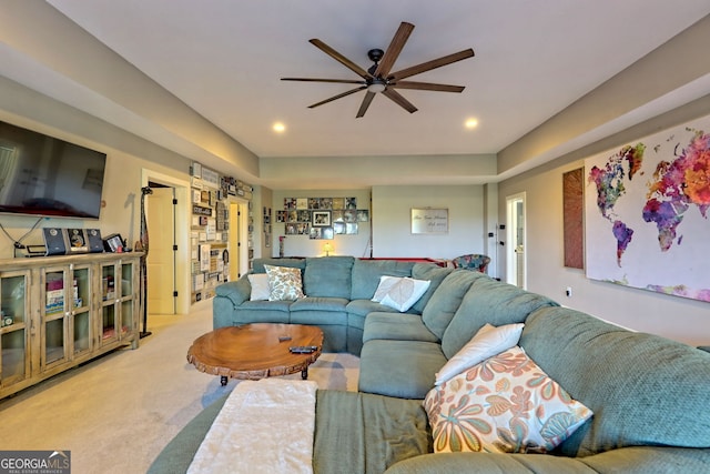 living room featuring ceiling fan and light colored carpet