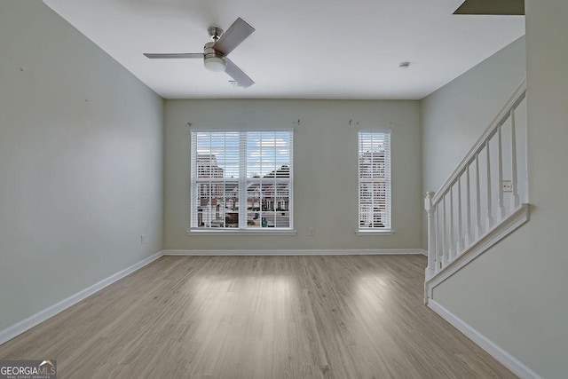 unfurnished room featuring ceiling fan and light hardwood / wood-style floors