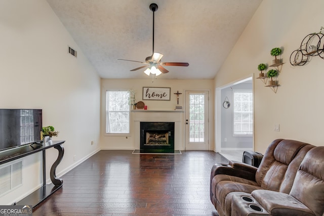 living room featuring high vaulted ceiling, ceiling fan, and dark wood-type flooring