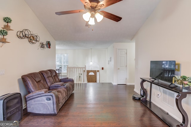 living room featuring dark hardwood / wood-style floors and ceiling fan