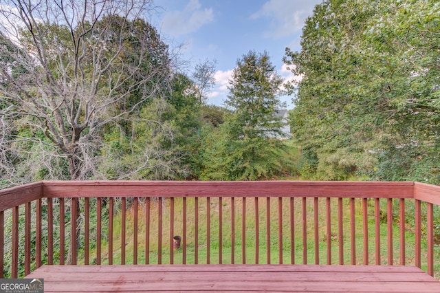 wooden terrace with a yard