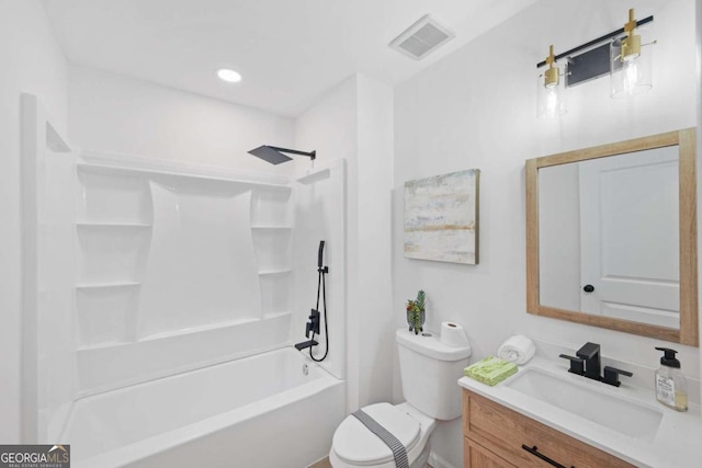 full bathroom featuring washtub / shower combination, vanity, and toilet