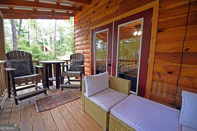 wooden deck featuring french doors