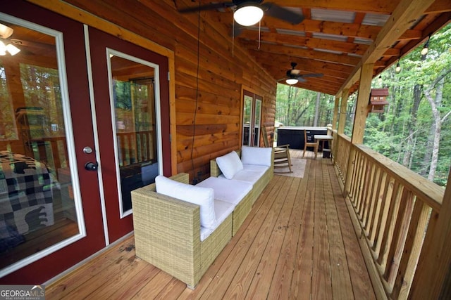 wooden deck featuring ceiling fan and an outdoor hangout area