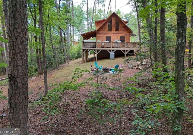 back of property with a wooden deck