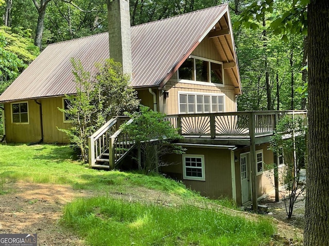 147 Wild Azalea Dr, Dillard, GA 30537 - back of property featuring a deck, a chimney, and metal roof
