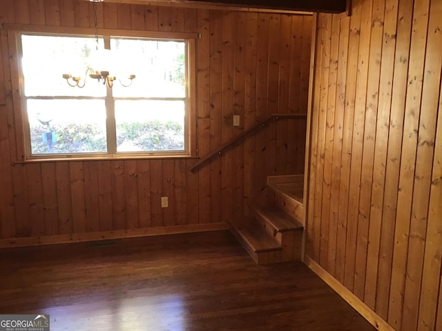 147 Wild Azalea Dr, Dillard, GA 30537 - stairway with a chandelier, wood finished floors, wooden walls, and baseboards