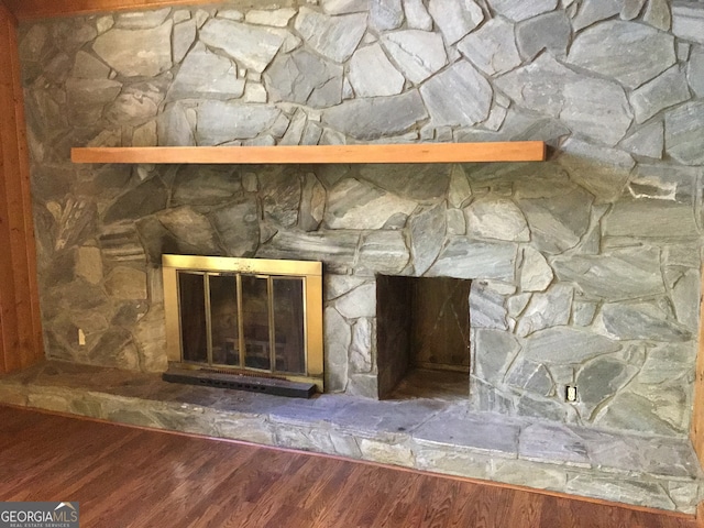 interior details featuring hardwood / wood-style floors and a fireplace