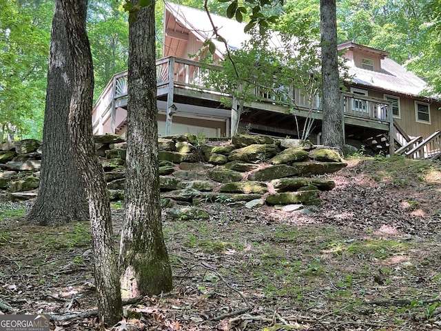 147 Wild Azalea Dr, Dillard, GA 30537 - back of property with stairway and a deck