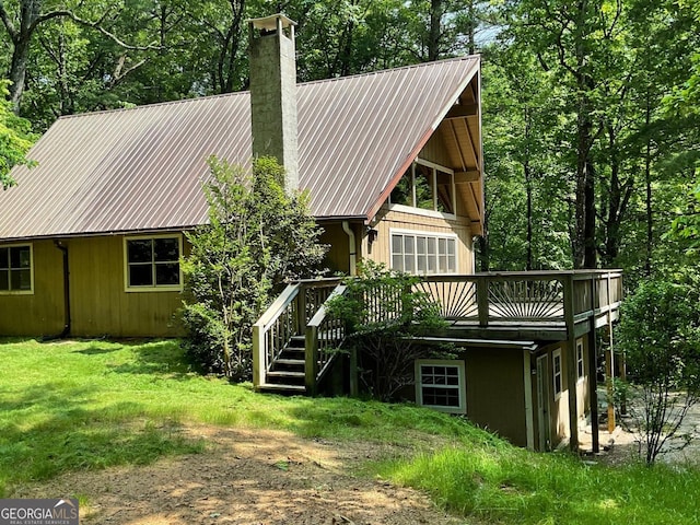 147 Wild Azalea Dr, Dillard, GA 30537 - back of property featuring a chimney, a wooden deck, and metal roof