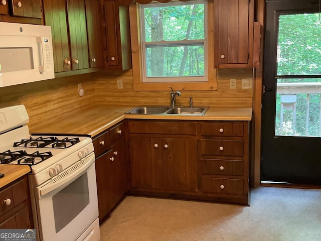 147 Wild Azalea Dr, Dillard, GA 30537 - kitchen featuring white appliances, light countertops, and a sink