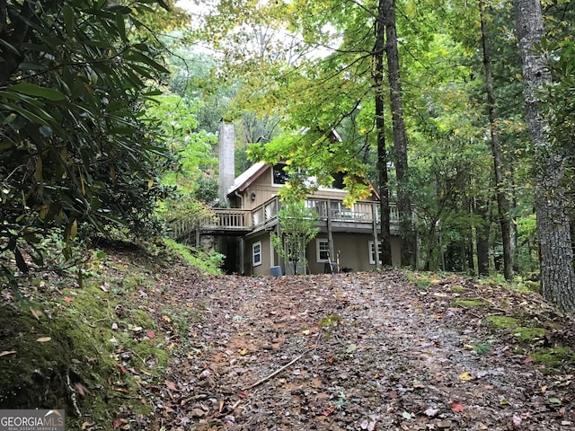 147 Wild Azalea Dr, Dillard, GA 30537 - rear view of property featuring a wooden deck and a wooded view