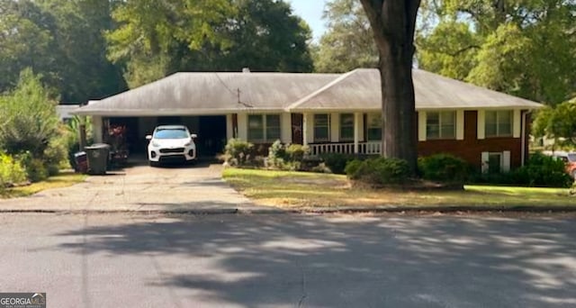 ranch-style home featuring a carport