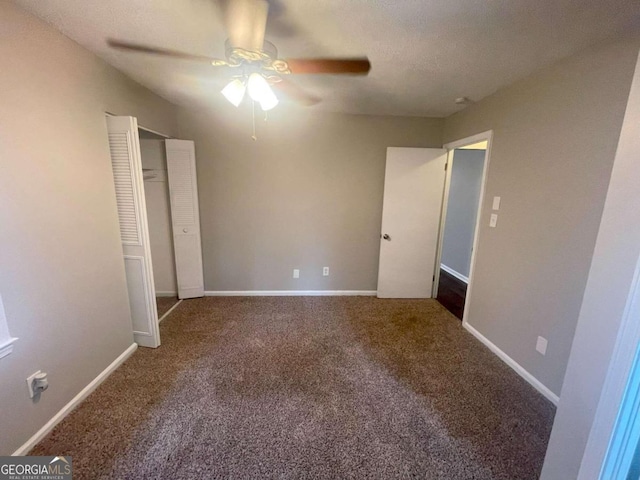 unfurnished bedroom with a closet, carpet, and ceiling fan