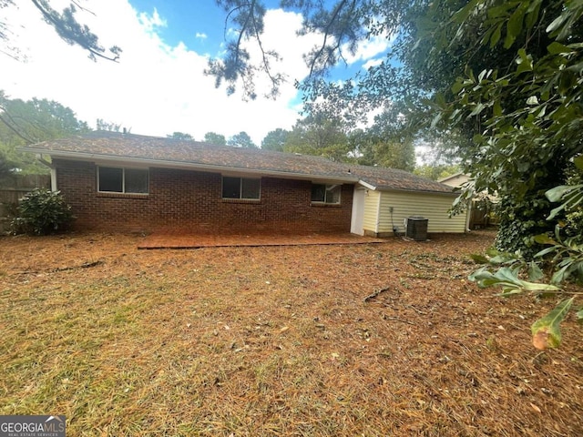 back of house featuring central AC