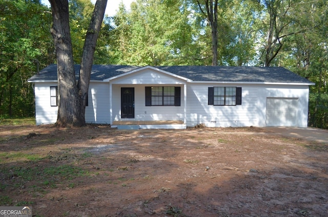 ranch-style house featuring a garage