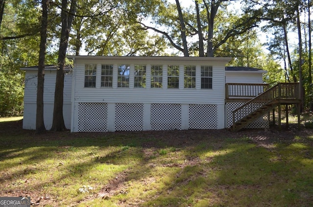 view of outbuilding with a yard