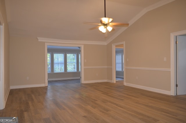 unfurnished room with wood-type flooring, vaulted ceiling, ceiling fan, and crown molding