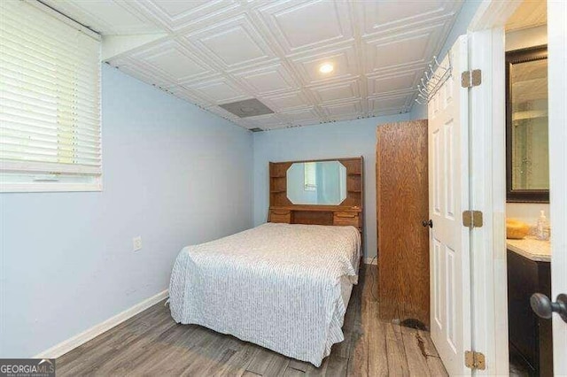 bedroom featuring dark hardwood / wood-style floors