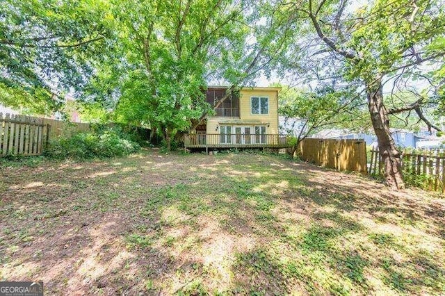 view of yard with a wooden deck