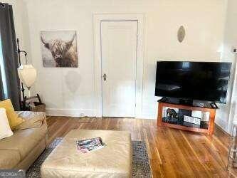 living room with hardwood / wood-style flooring