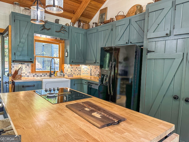 kitchen featuring pendant lighting, tasteful backsplash, wood ceiling, vaulted ceiling with beams, and sink