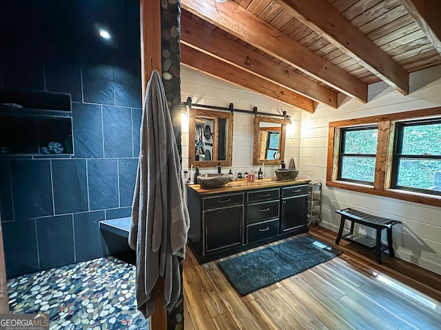 bathroom with hardwood / wood-style flooring, wood walls, vanity, wood ceiling, and vaulted ceiling with beams