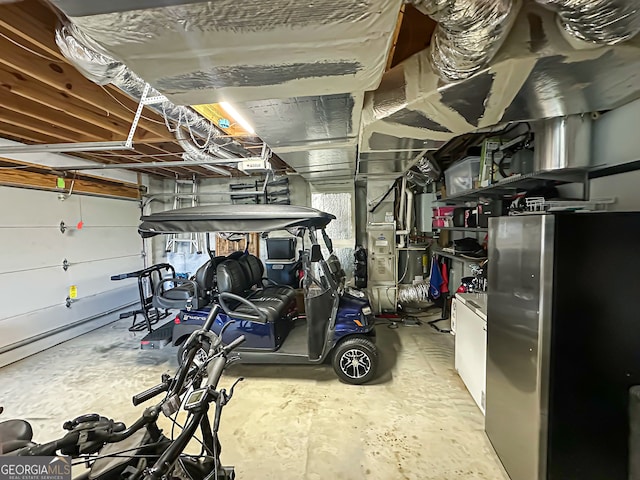 garage featuring stainless steel fridge