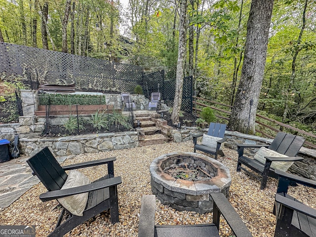 view of patio featuring an outdoor fire pit