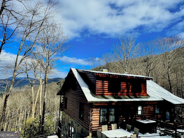 cabin featuring a mountain view