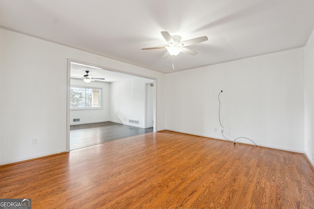 spare room featuring ceiling fan and wood-type flooring