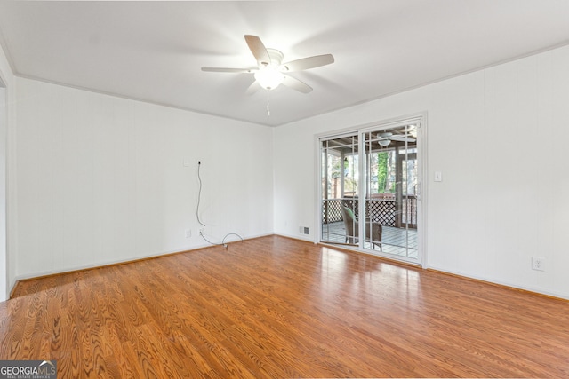 unfurnished room featuring ceiling fan and hardwood / wood-style flooring