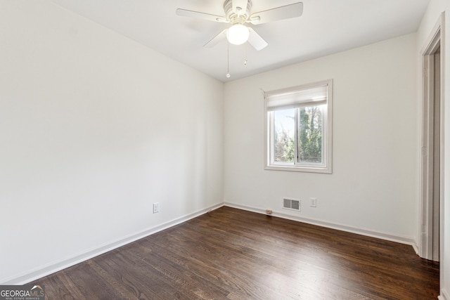 unfurnished bedroom with ceiling fan and dark hardwood / wood-style flooring